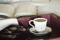 Cafe Escapes Coffee Cup on Bed with Book Relax