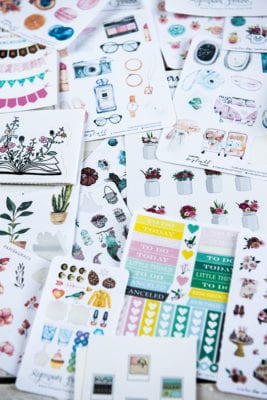 table full of bullet journal stickers